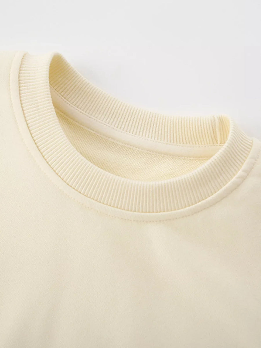 Cream crew-neck sweatshirt for kids with ribbed collar detail
