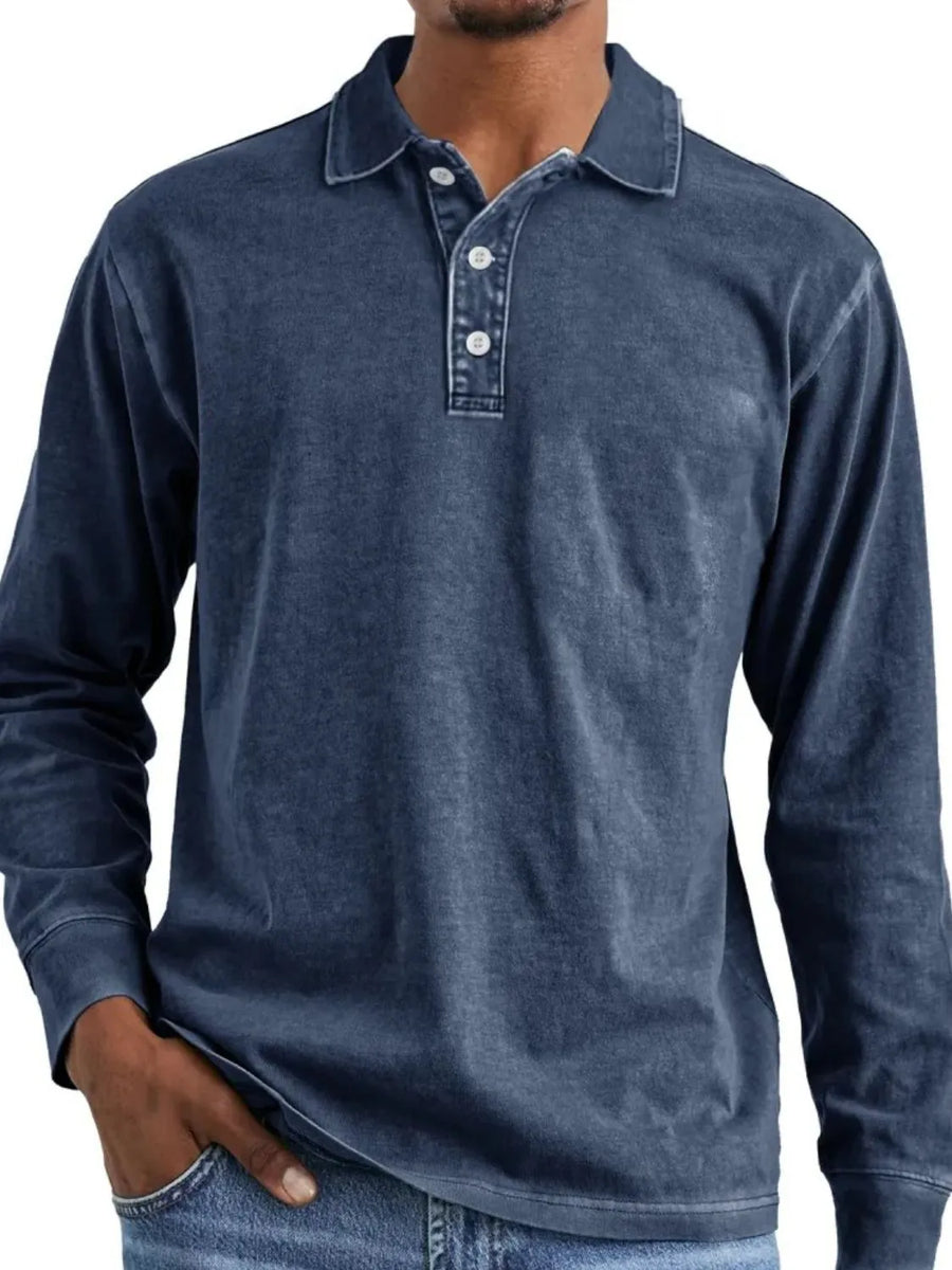 Long-sleeve polo shirt in Dusty Blue with a vintage wash and button placket.