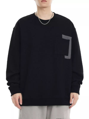 Black crew neck sweatshirt with textured fabric and chest pocket detail
