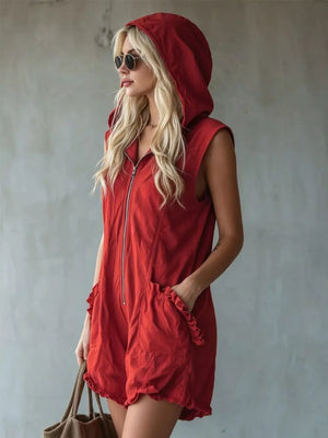 Red hooded sleeveless romper with ruffled pockets and zipper front.