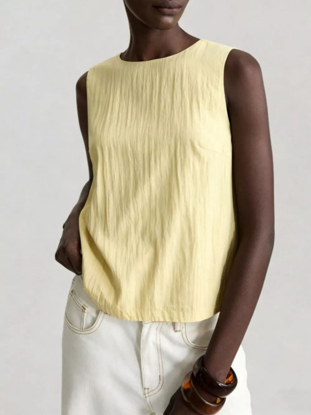 Textured crinkle tank top with round neck in yellow, featuring dart detail.