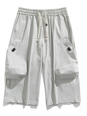 Light Gray cargo capris with adjustable drawstring and large side pockets.
