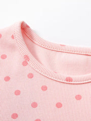 Pink ribbed cotton toddler dress with red polka dots and crew neck detail.