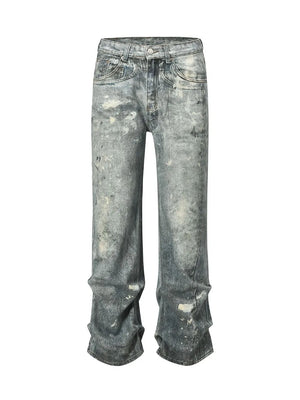 Distressed wide-leg jeans in medium wash denim with painterly details and a casual fit.