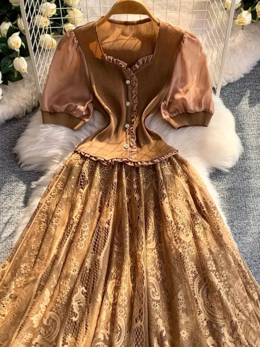 Brown lace-embellished puff sleeve dress with button front and ruffled neckline.