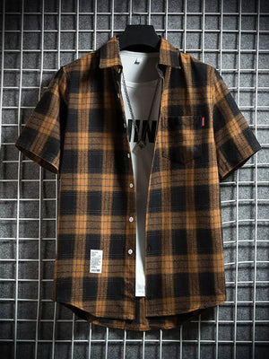 Classic plaid short-sleeve men's shirt in brown and black cotton with chest pocket.