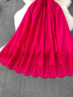Charming eyelet maxi dress in bright red with scalloped hem and floral cutouts.