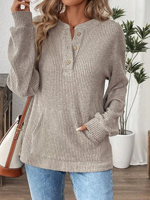 Gray ribbed long-sleeve top with button detail and front pocket.