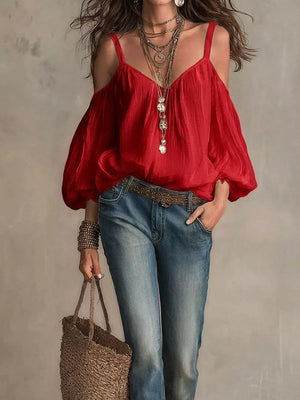 Red cold shoulder balloon sleeve shirt with spaghetti straps and V-neck.