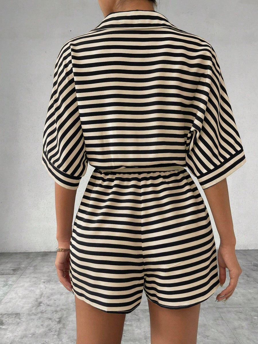 Black and tan striped romper with short sleeves and elastic waist shorts.