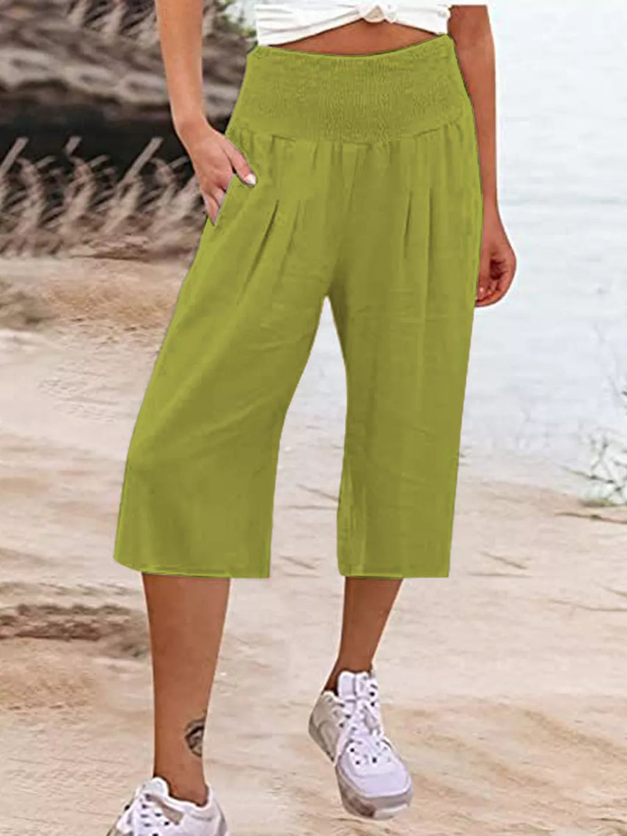 Cropped linen pants in lime green with smocked waist and pockets