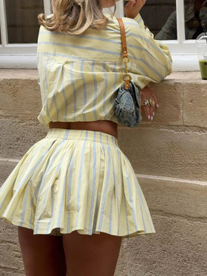 Yellow striped button-up shirt and pleated mini skirt set
