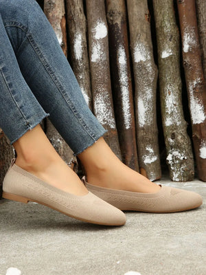 Beige knit ballet flats with subtle chevron detail and flexible sole.