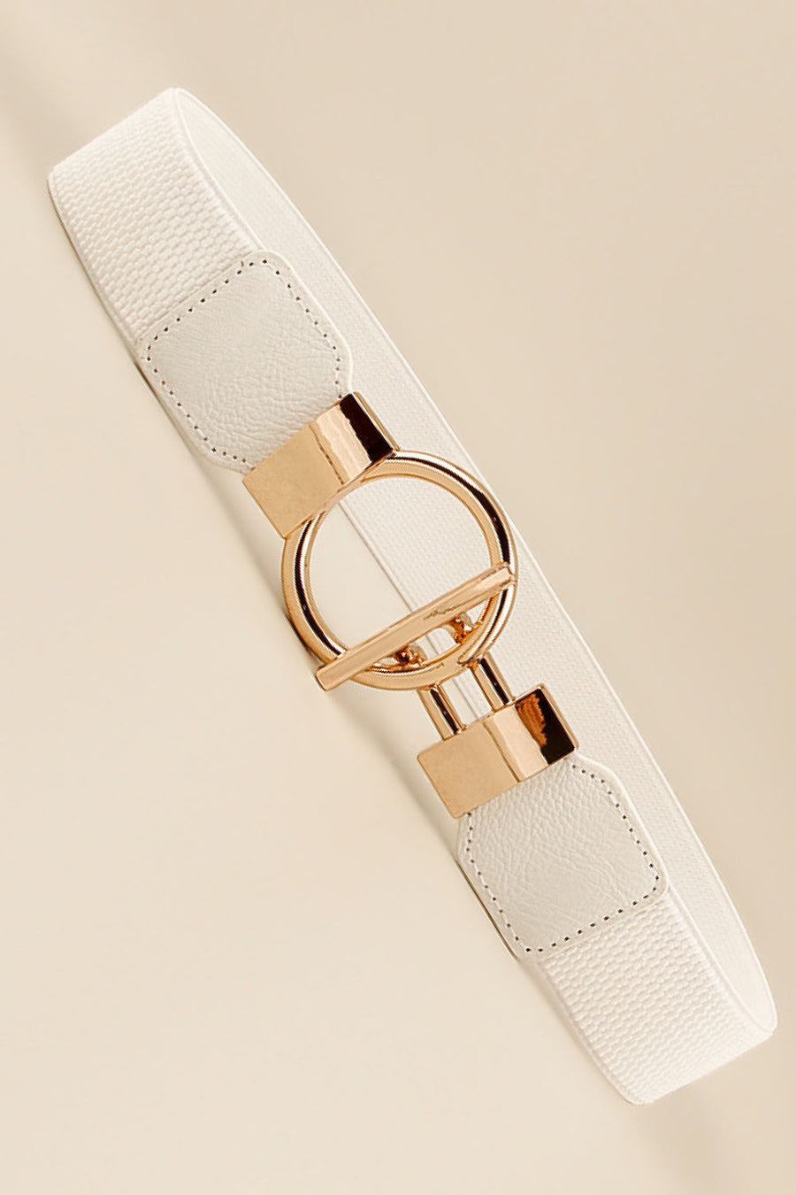 White elasticated ring buckle belt with gold-tone hardware and faux leather details.