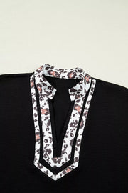Black polyester tunic with leopard print notched neckline and trim
