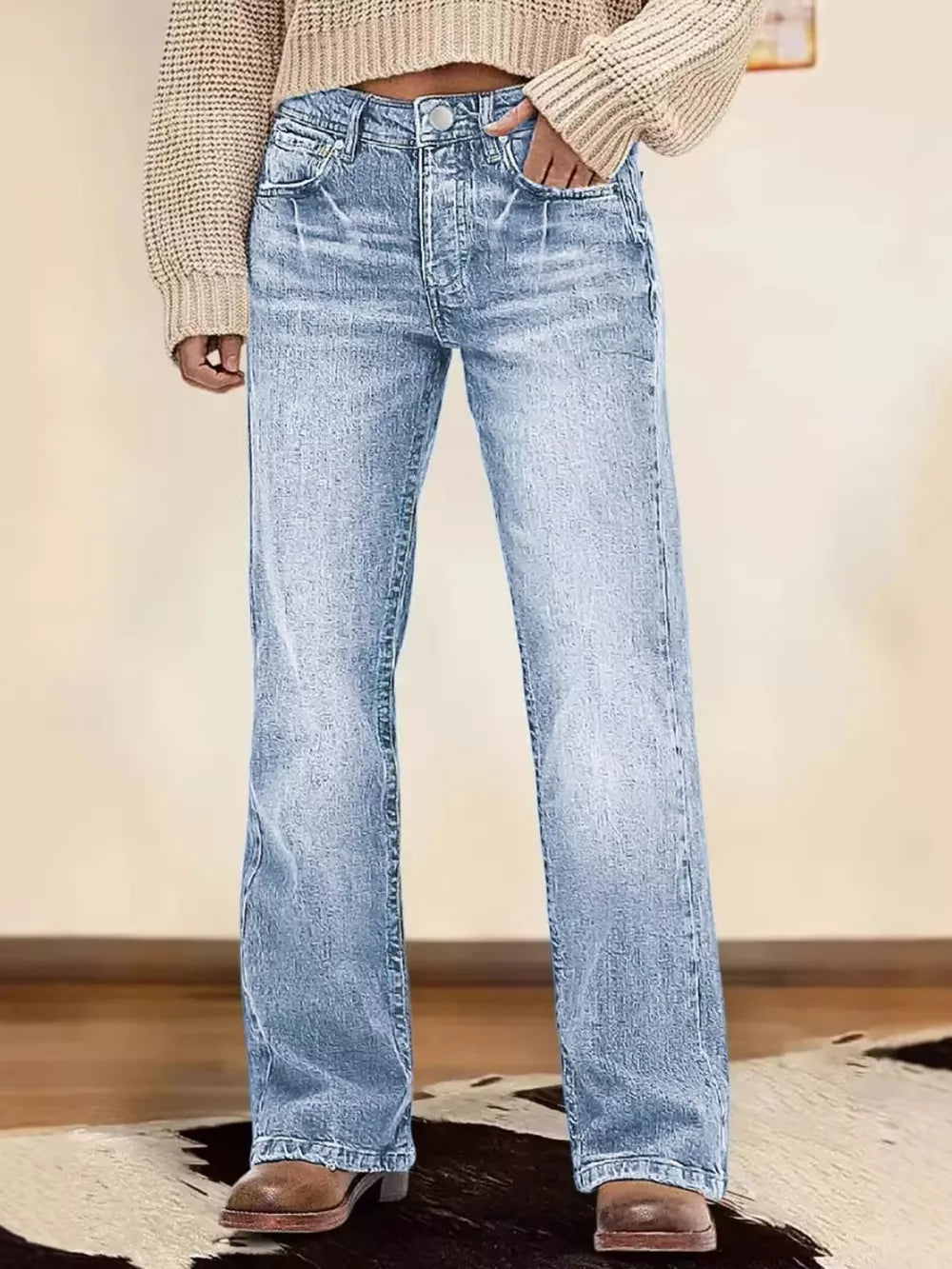 Light blue vintage wash straight leg denim jeans with button fly.
