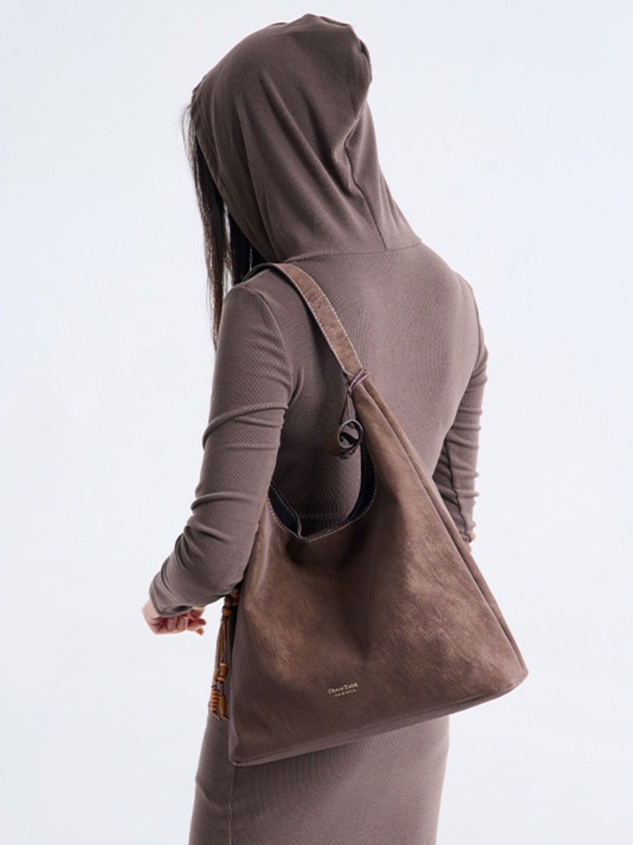 handbag in Brown with decorative tassel and large