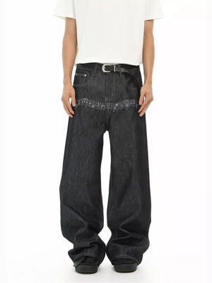 Loose fit dark wash denim jeans with embroidered musical notes detail.