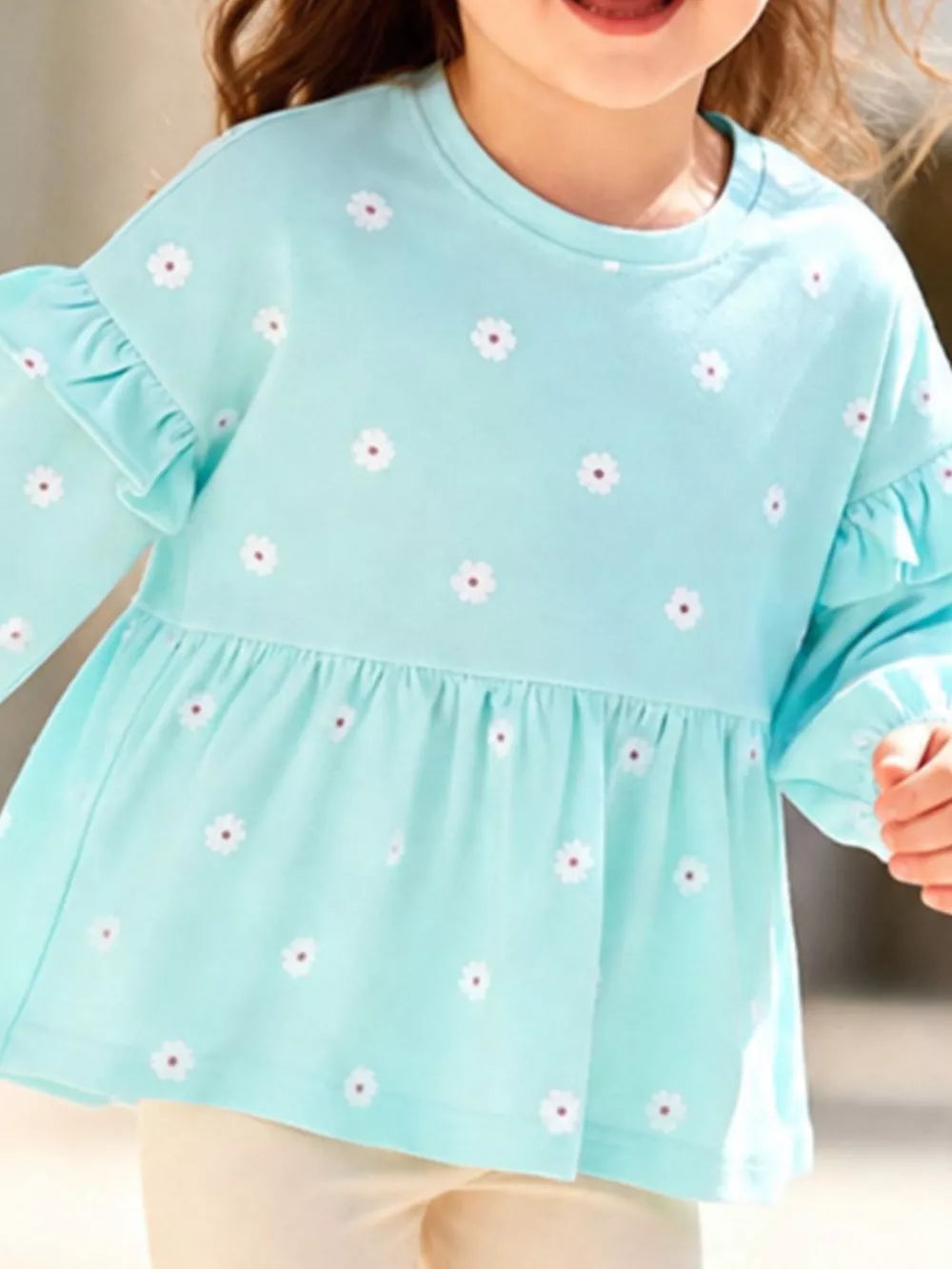 90% cotton, 10% polyester Care instructions: Machine wash cold peplum top in Pastel Blue with A-line silhouette