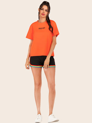 Orange t-shirt with black "SOLD OUT" graphic, crew neck, short sleeves.