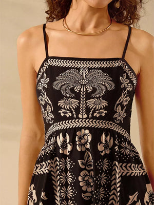 Black floral print spaghetti strap maxi dress with a square neckline and bohemian pattern.