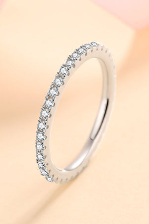Sterling silver eternity band ring with micro-pave set cubic zirconia stones.