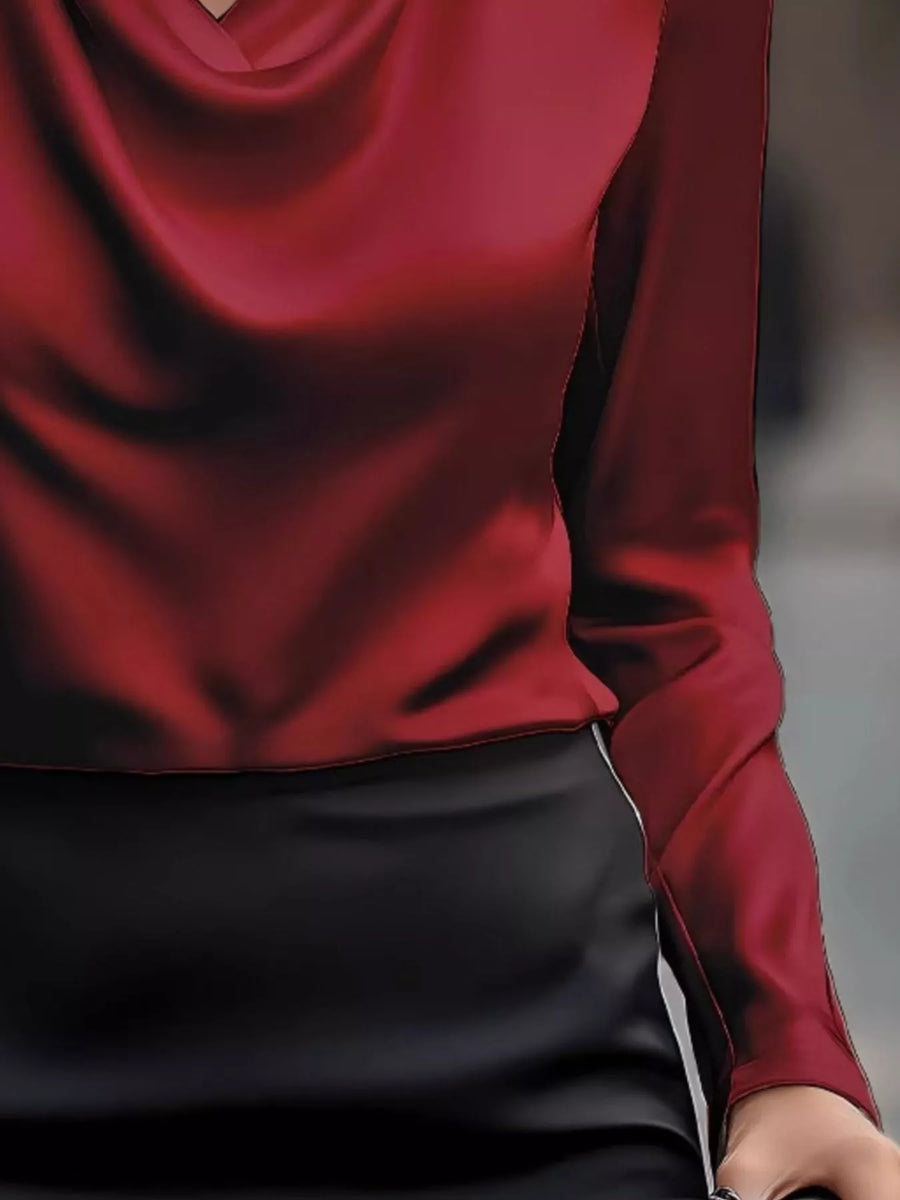 Burgundy satin cowl neck long-sleeve blouse with draped neckline.