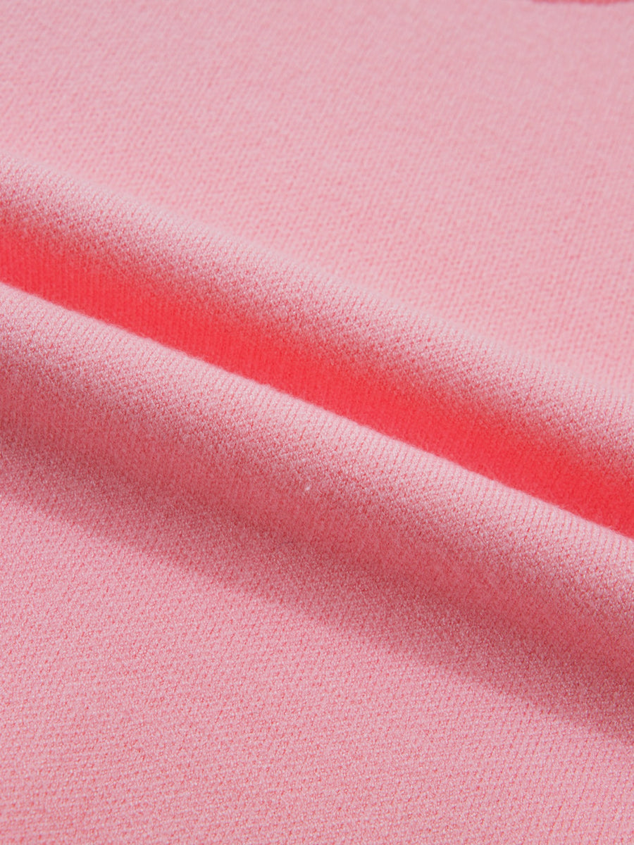 Pink knit sweater with scalloped hem detail