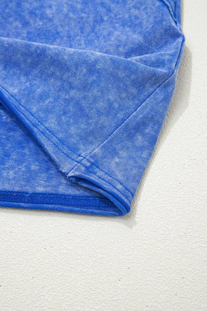 Blue mineral wash cotton t-shirt with distressed texture and subtle lace trim detail