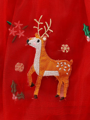 Red tulle dress with festive elk embroidery and floral accents.
