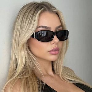 black sunglasses featuring UV protection and leopard-print