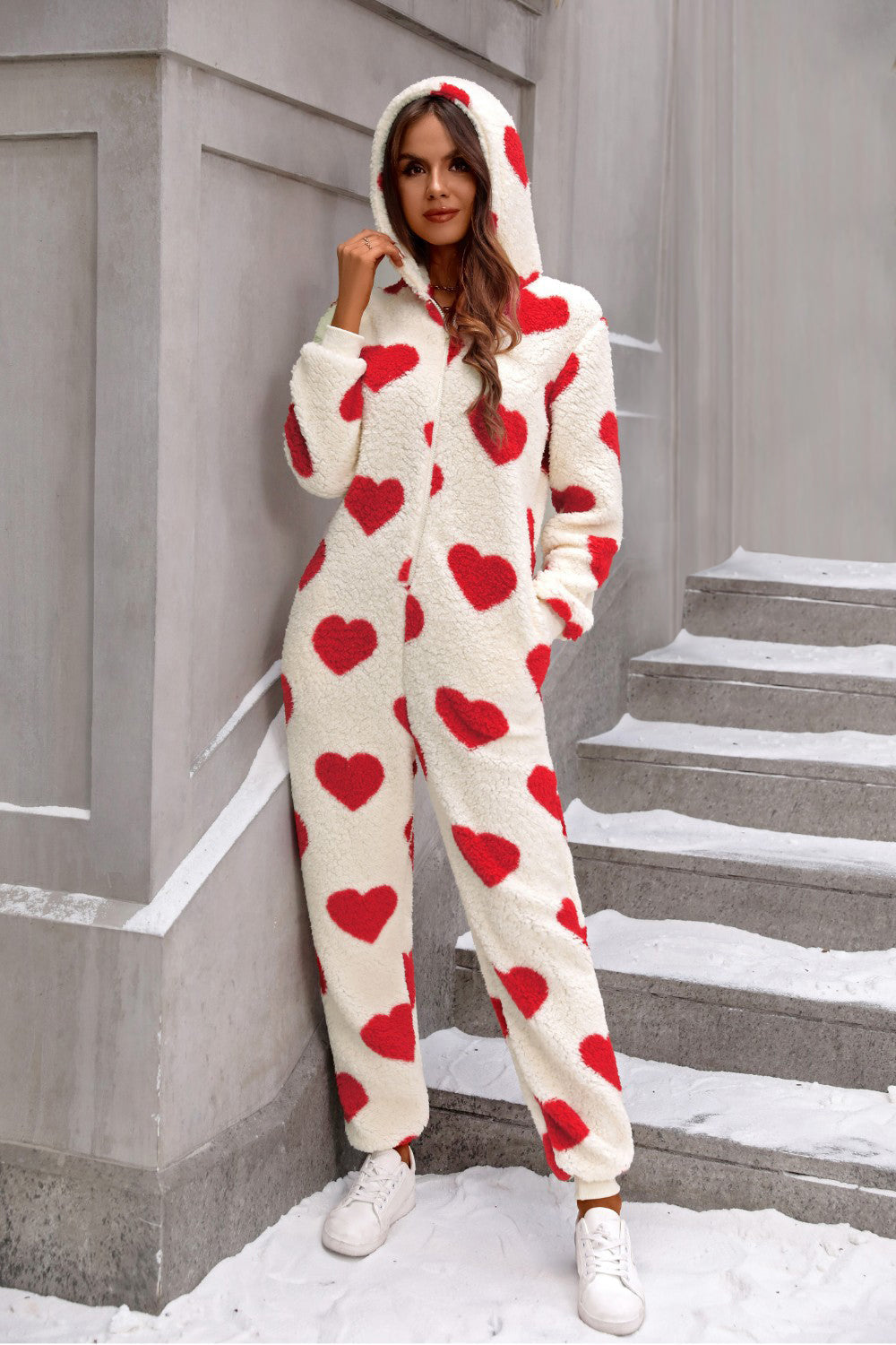 Heart-print sherpa onesie with hood and pockets, cream with red hearts