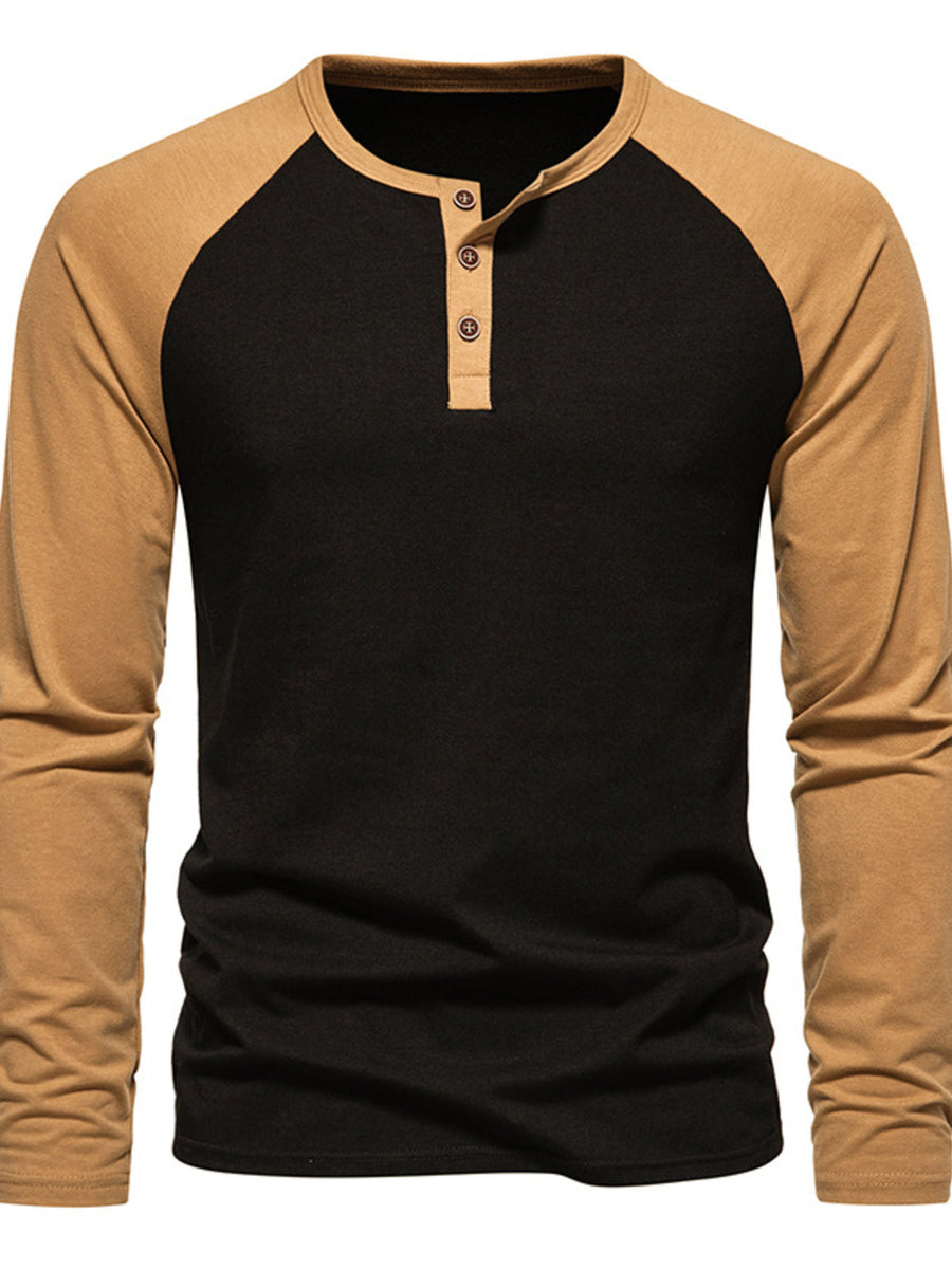 Men's long sleeve black henley t-shirt with tan raglan sleeves and button placket.