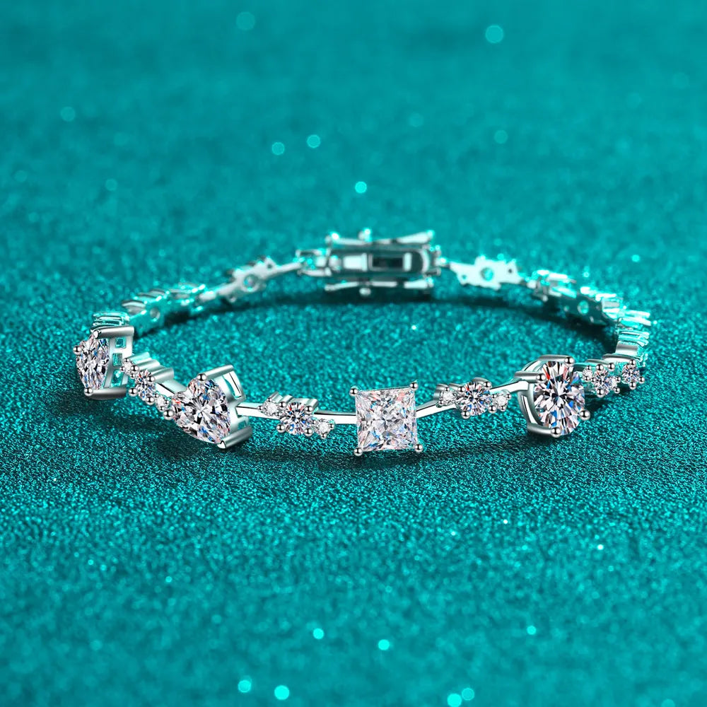 Silver geometric moissanite bracelet with square and round stones.