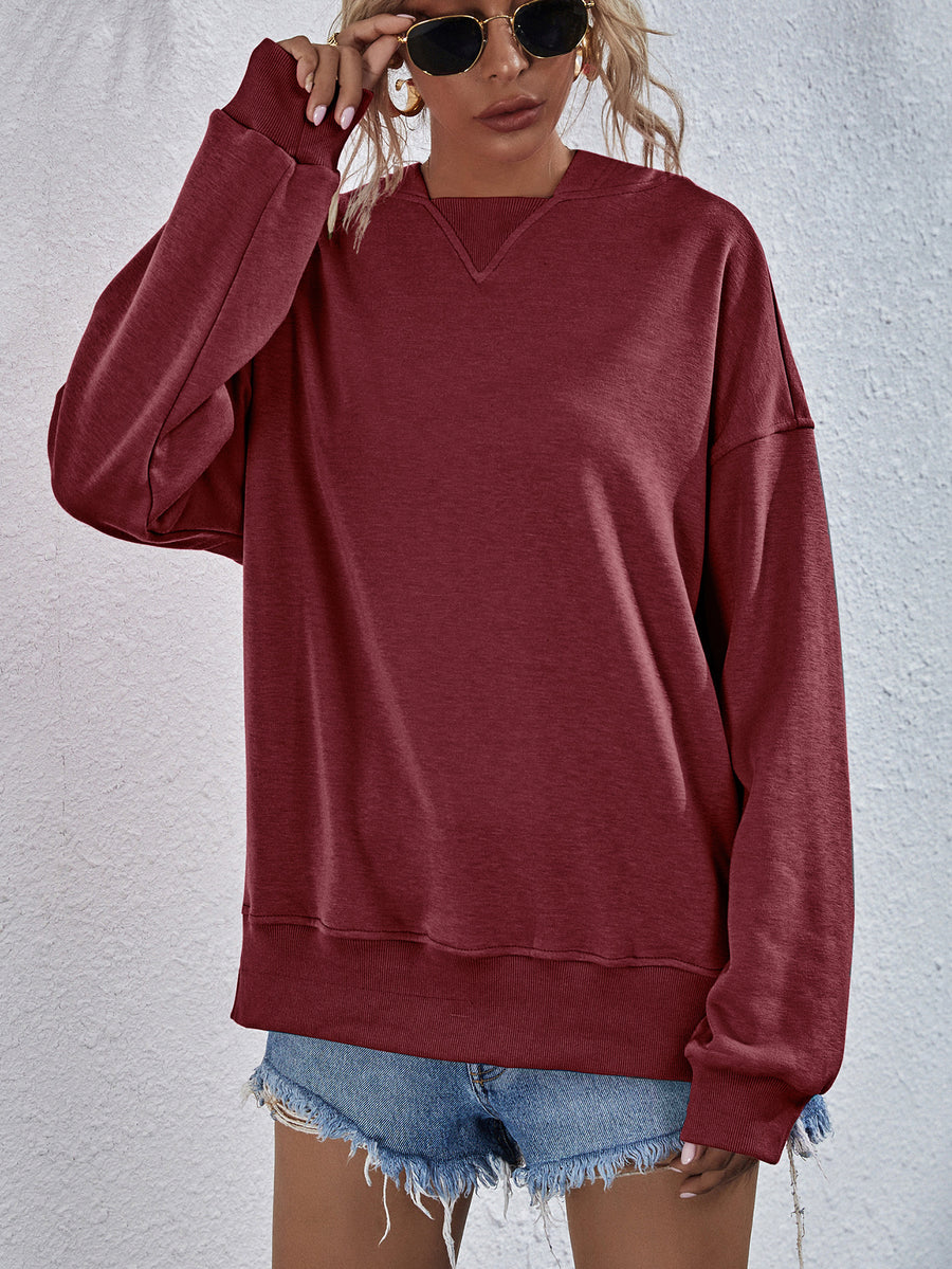 Brick Red sweatshirt with V-neck detail and ribbed cuffs and hem.