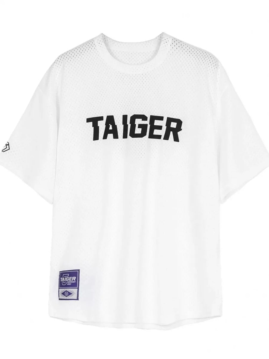 White mesh oversized t-shirt with black TAIGER graphic and embroidered patch.