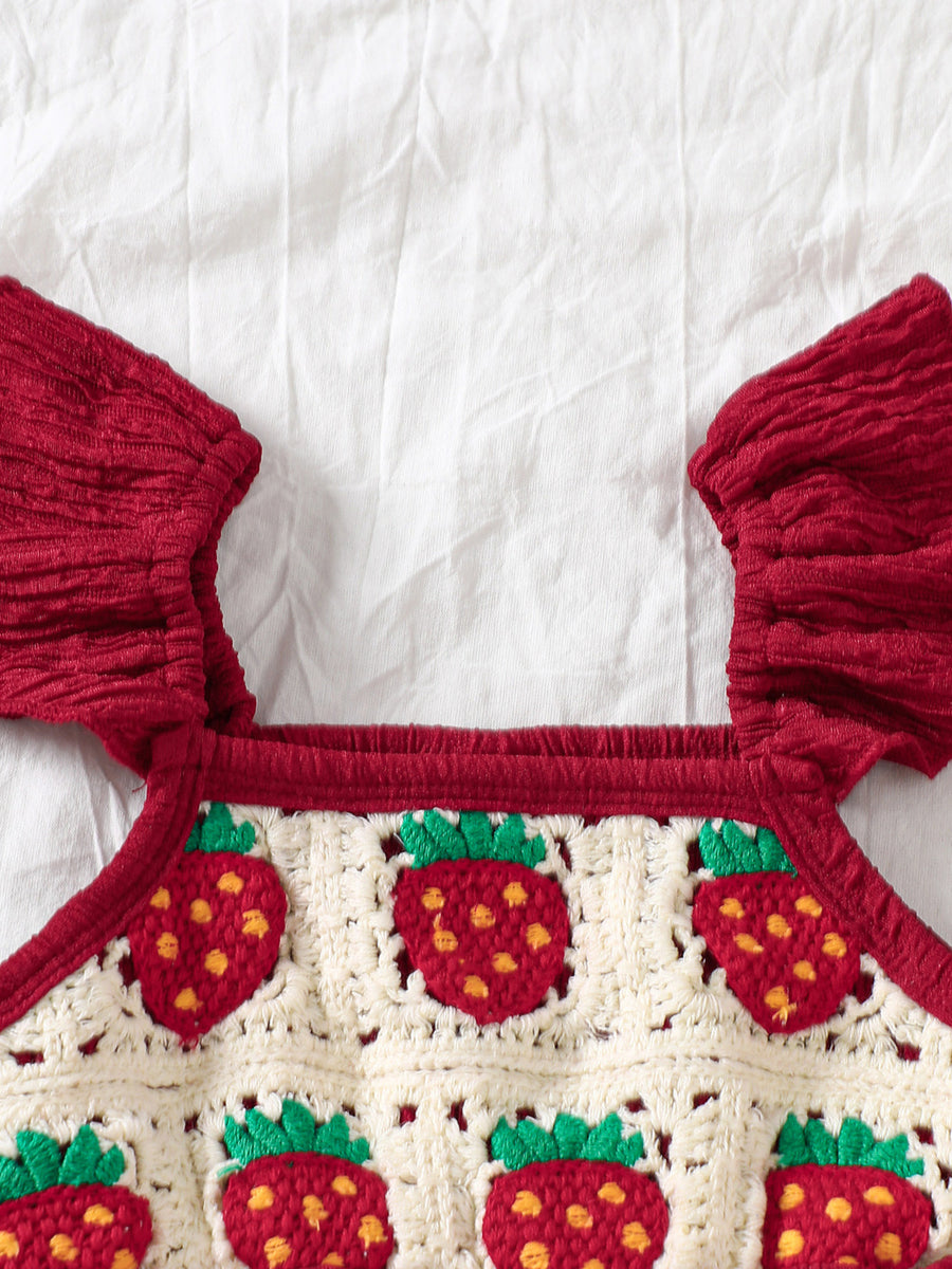 Crochet baby jumpsuit in burgundy with strawberry pattern and ruffle sleeves