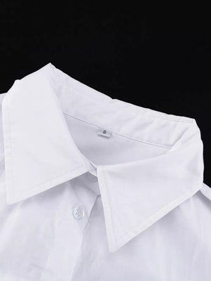 White button-up shirt with a classic collar and visible buttons.
