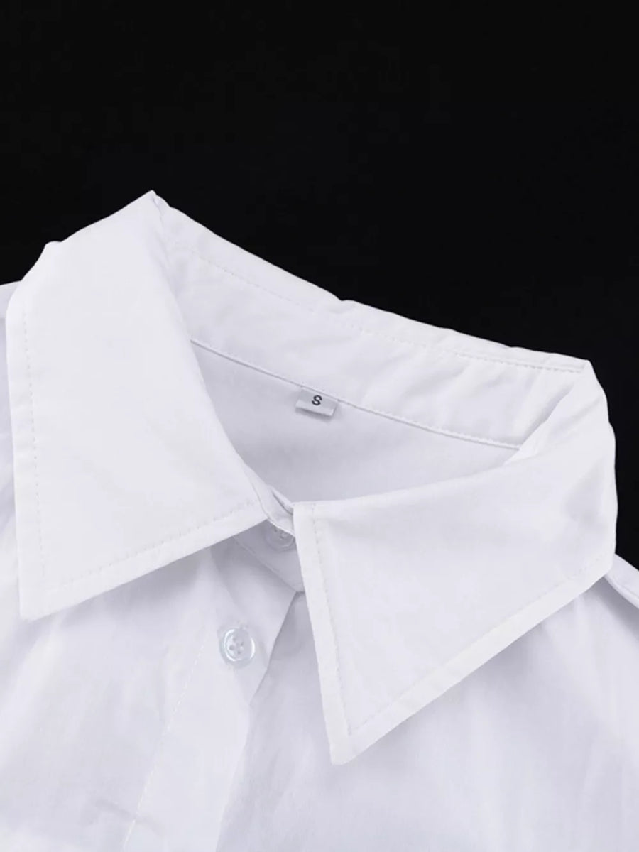 White button-up shirt with a classic collar and visible buttons.