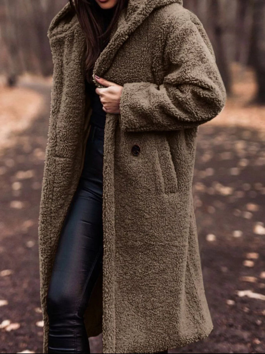 Longline teddy bear coat in brown with hood and button closure.