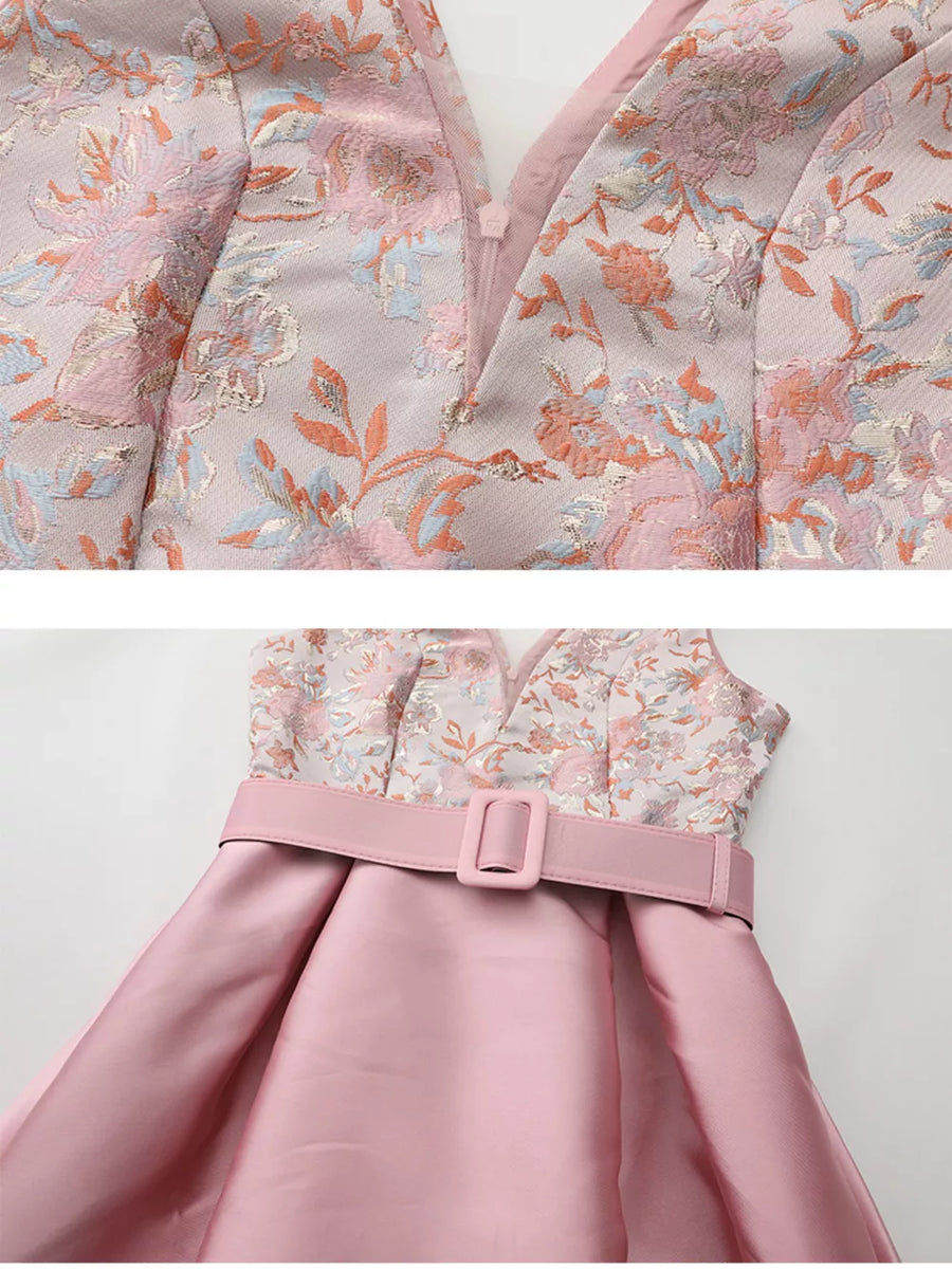 Pink midi dress with floral appliqué bodice and belted waist