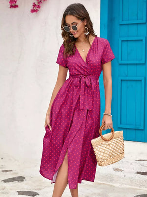 Pink polka dot wrap dress with tie waist and short sleeves