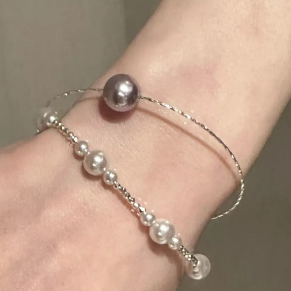 bracelet in silver featuring pearl embellishment and fitted fit