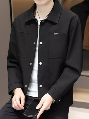 Men's black snap down jacket with chest pocket detail and white snaps.