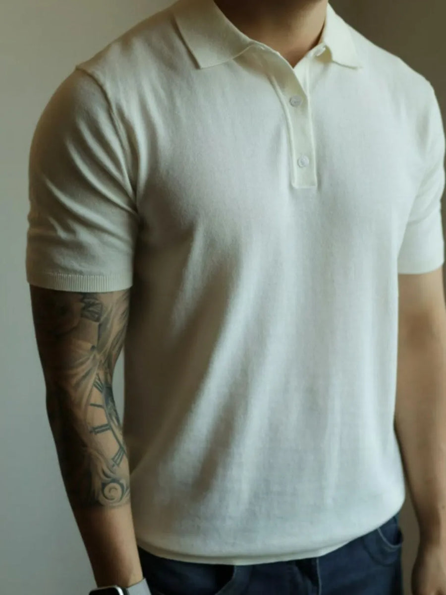 Ivory fine-gauge knit polo with refined placket and short sleeves.