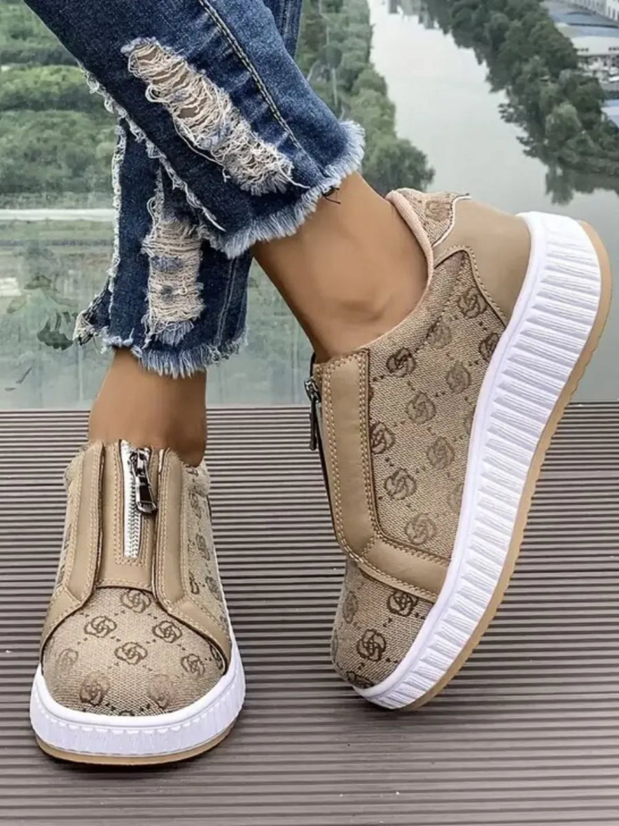 Tan logo print zip-up platform sneakers with white soles.