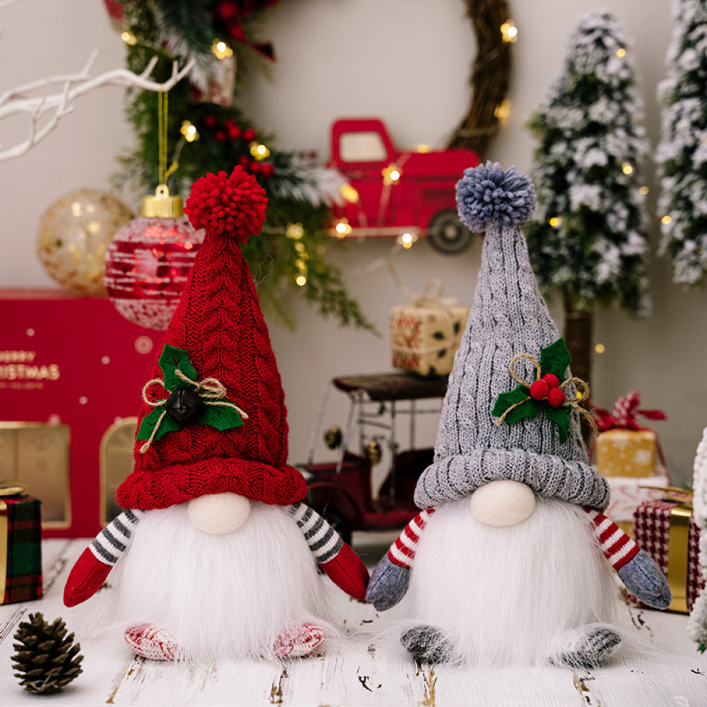 Illuminated knit gnome duo in deep red and light gray with white beards and festive hats.