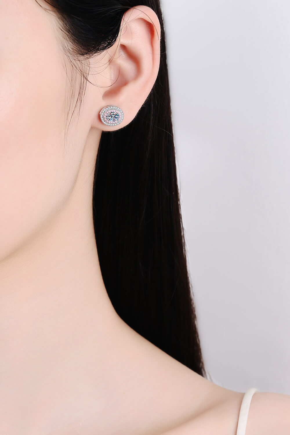 Halo moissanite stud earrings with pink accents and white halo detail