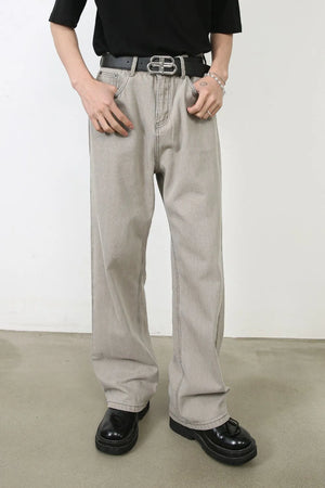 Gray wide-leg denim trousers with seam detail and a relaxed fit.