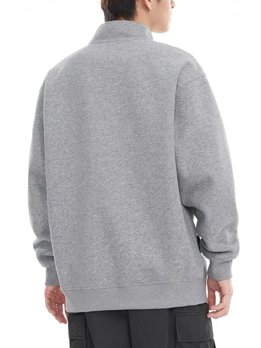 Gray cotton blend sweatshirt pullover with buttoned neckline and long sleeves.